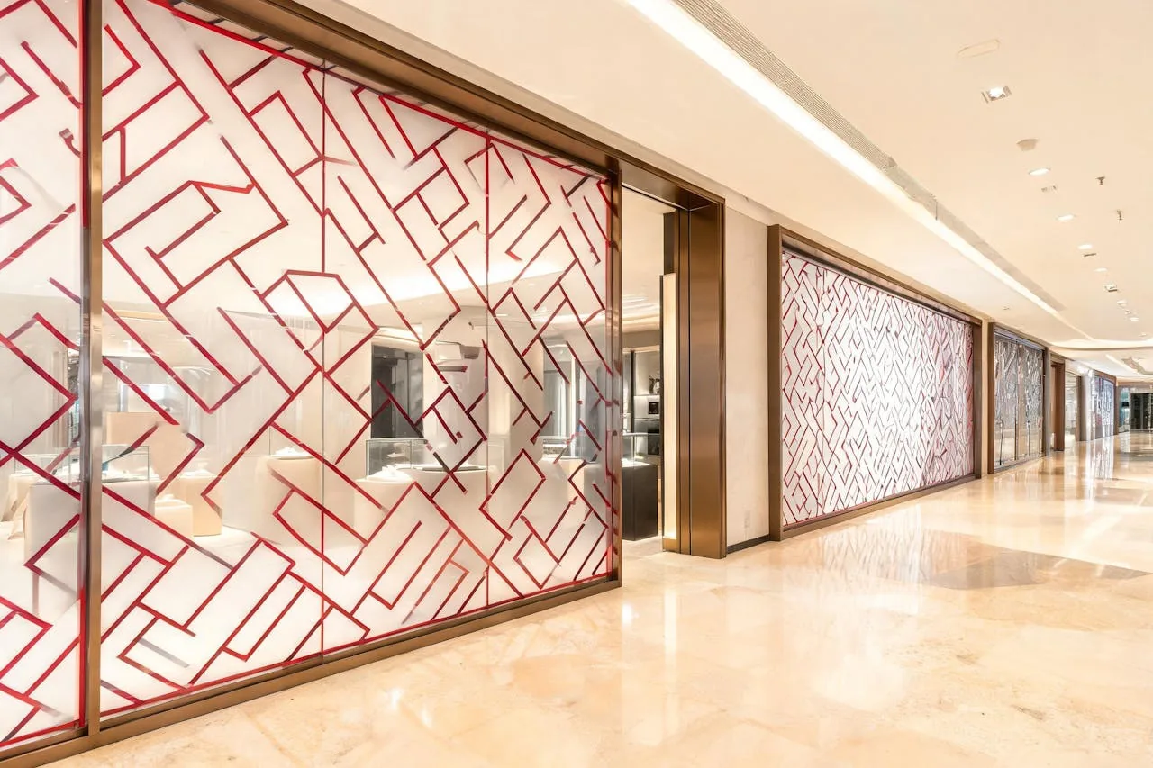 Boutique storefront glass with printed design film in an upmarket mall